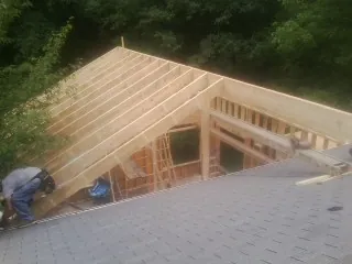 Framing a new roof addition that ties into an existing shingle roof in Victor